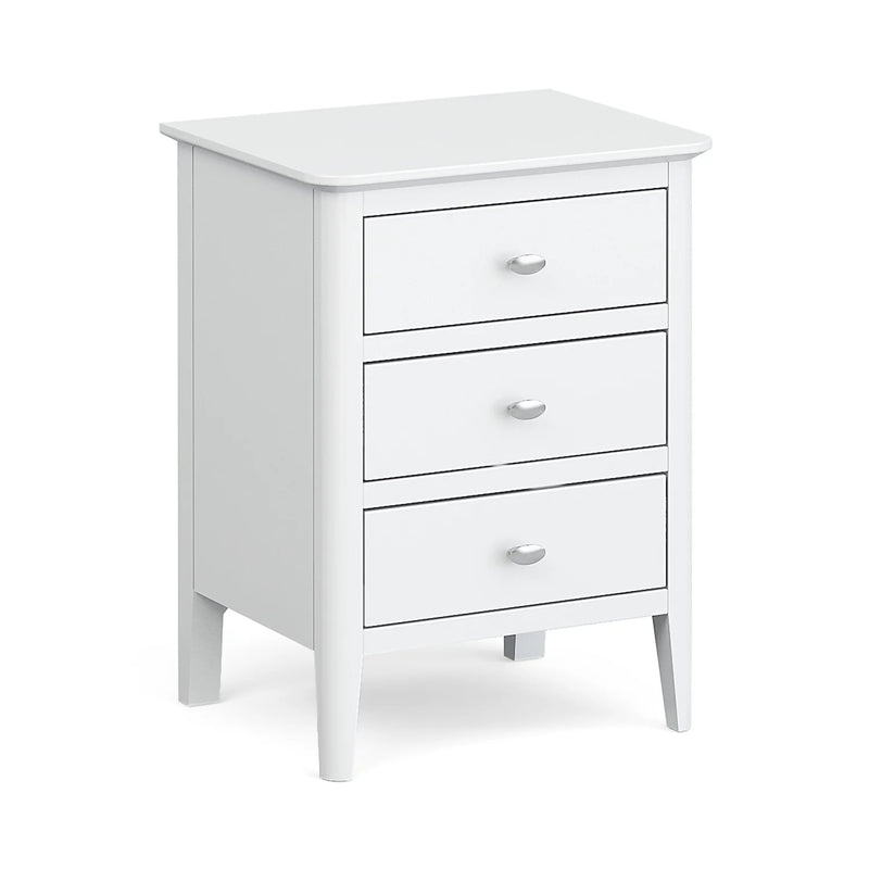 A white bedside locker with a chrome handle, featuring a rectangular top and three drawers below.