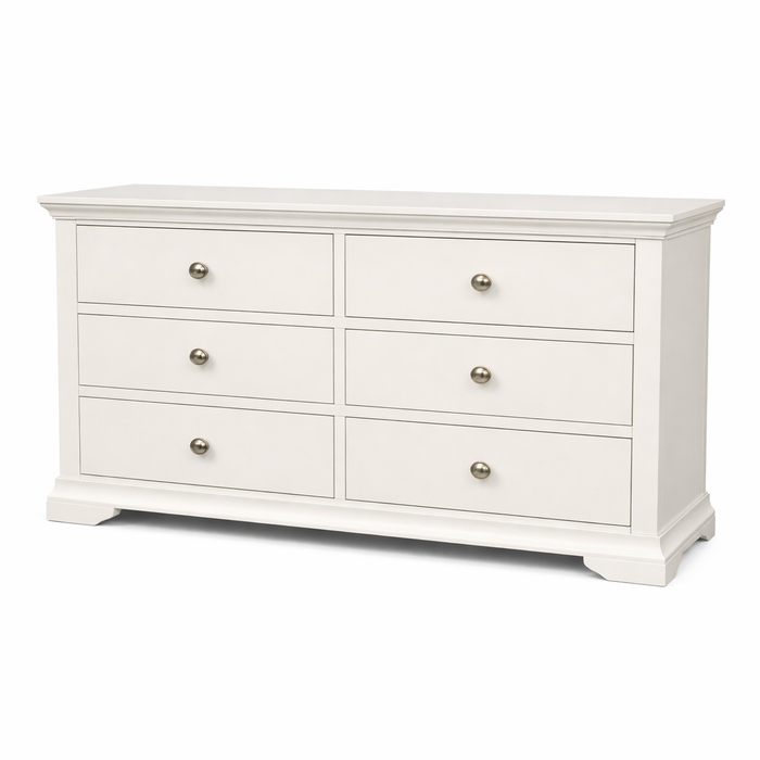 The Malmo Wide Chest of Drawers is a white wooden unit with 6 drawers, round metal knobs, and short sturdy legs—ideal for modern bedroom storage solutions.
