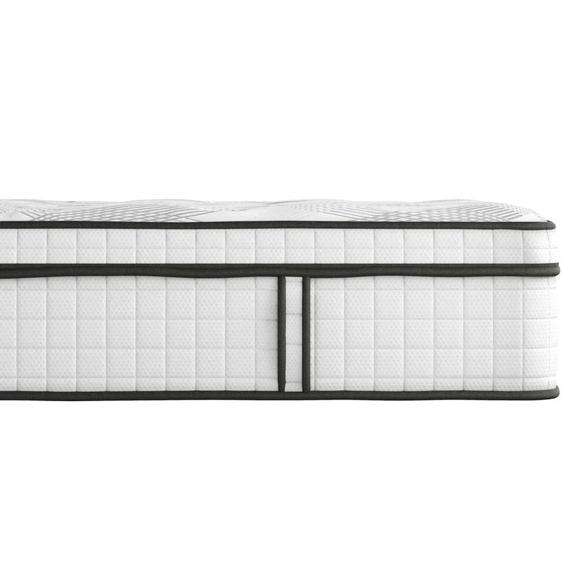 A close-up side view of the Adare Mattress showcases its quilted pattern and black trim, emphasizing the textured fabric and layered construction of this medium to firm mattress.