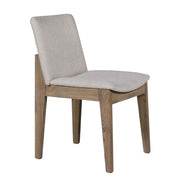 The Falun Dining Chair features solid oak legs, a cushioned light gray fabric seat, and a slightly angled backrest. Its natural wood frame blends comfort with contemporary style.