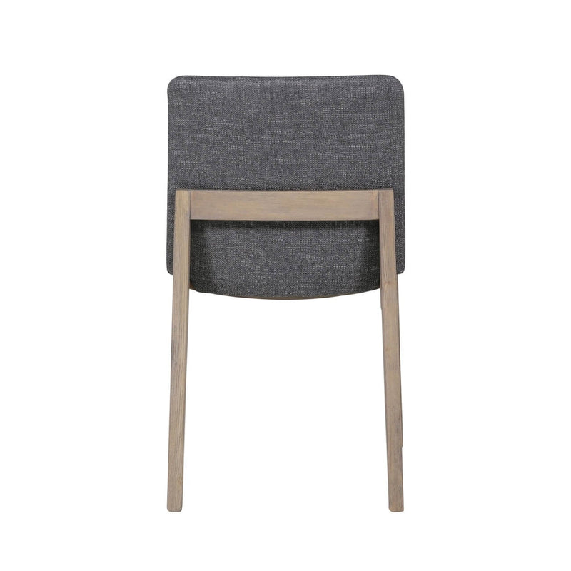Back view of the Falun Dining Chair, featuring solid oak legs and a rectangular, dark gray upholstered backrest, shown against a white background.