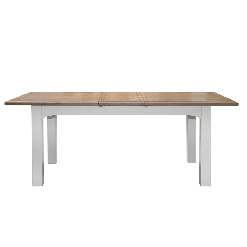 Two-tone wooden dining table with a visible extension leaf seam and painted base.