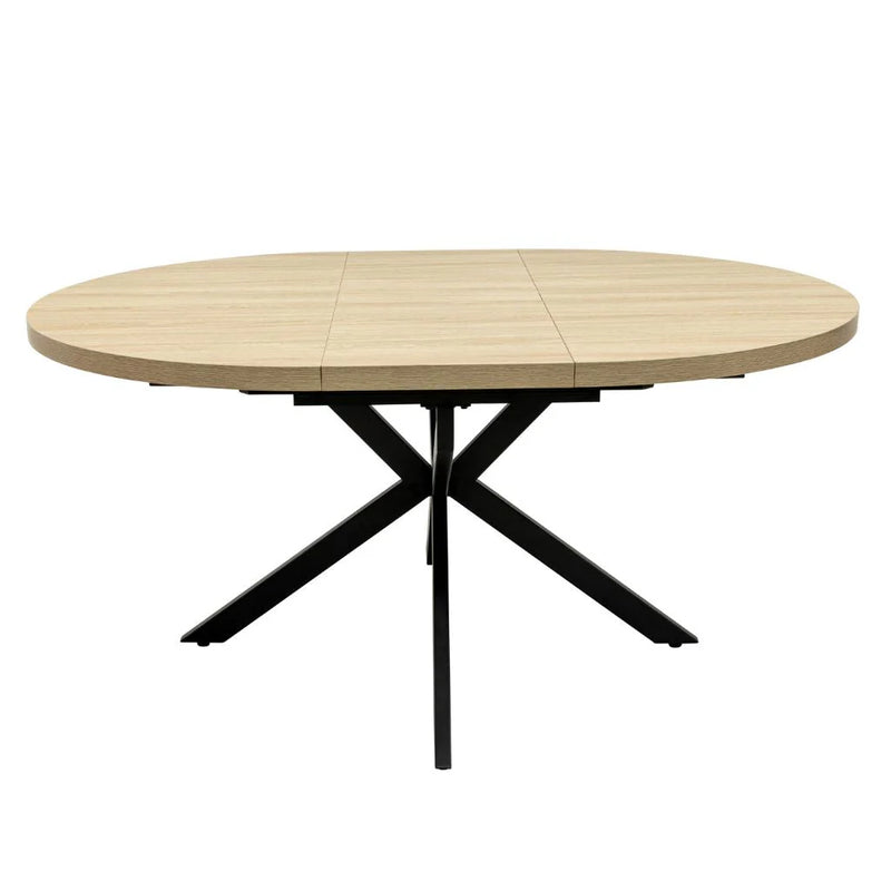 The Dalton Table + 4 Lyra Chairs set features a round light wood dining table with black X-shaped metal legs, offering an industrial, modern look perfect for contemporary spaces.