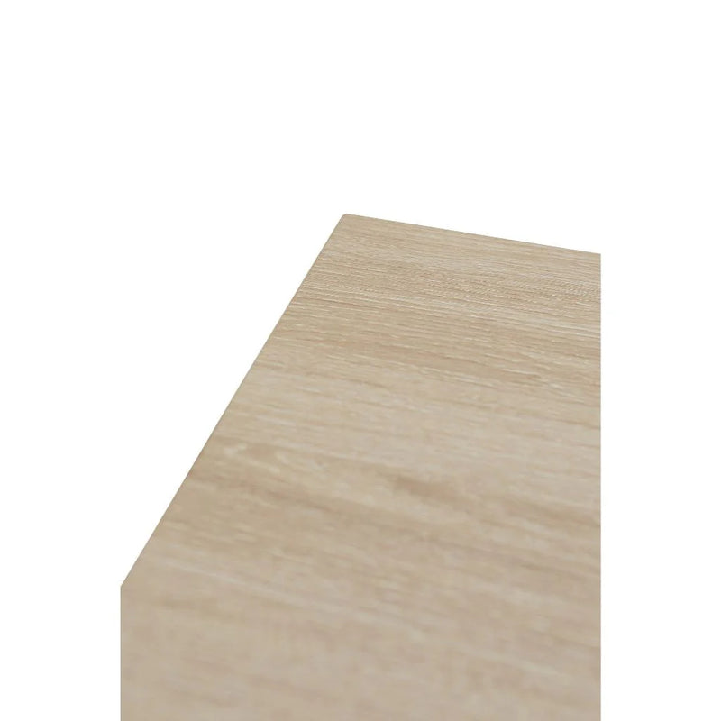 A close-up view of the corner of the Dalton 1.6 Extending Table’s light wood-effect tabletop, set against a plain white background.