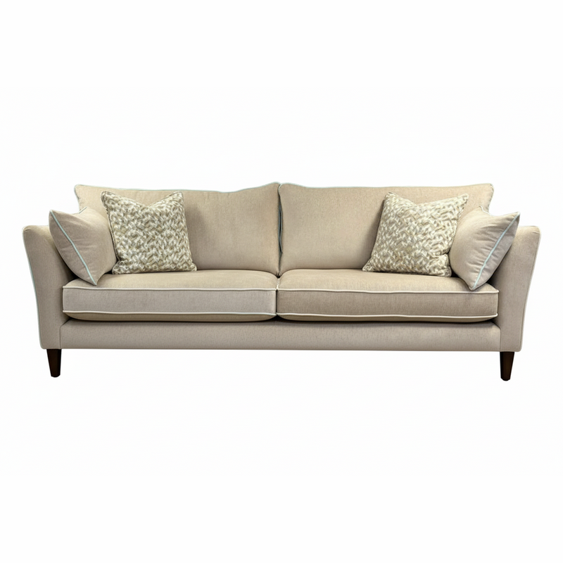 The beige Layla Grand Sofa, Irish-made with two seat and back cushions plus four decorative pillows in washable aquaclean fabric, is shown on a white background.