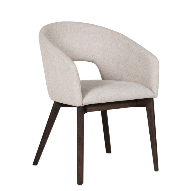 The Ariya bucket chair features a modern design with a curved, upholstered beige backrest and seat, an open lower back for comfort, and four angled dark wood legs.