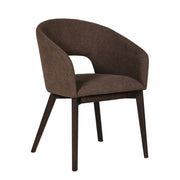 Contemporary curved armchair in a chocolate brown color.