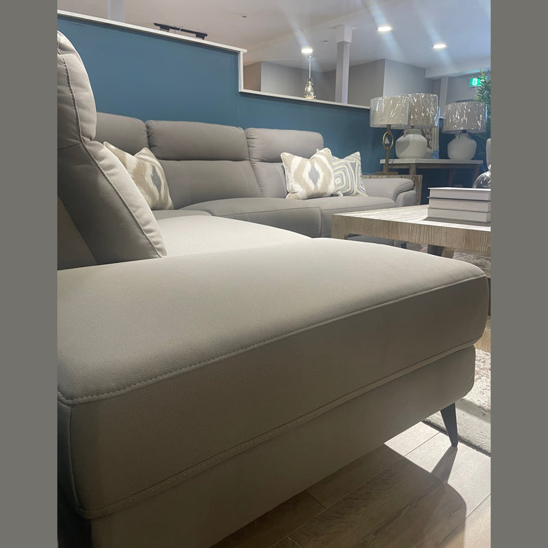The Chloe Corner Group in natural taupe pairs perfectly with a coffee table to create a cozy, modern living room.