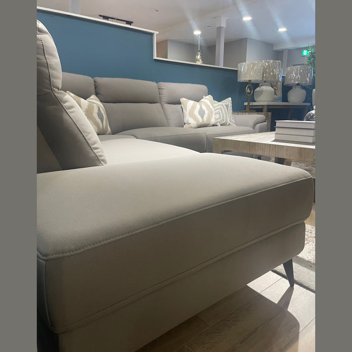 The Chloe Corner Group in natural taupe pairs perfectly with a coffee table to create a cozy, modern living room.