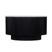 Product image of a round or oval black coffee table with a dramatic fluted texture.