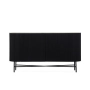 The Lucas Large Sideboard features a modern black finish with vertical grooves, a light-toned top, and slim black legs with crossbar support, beautifully showcased against a white background.