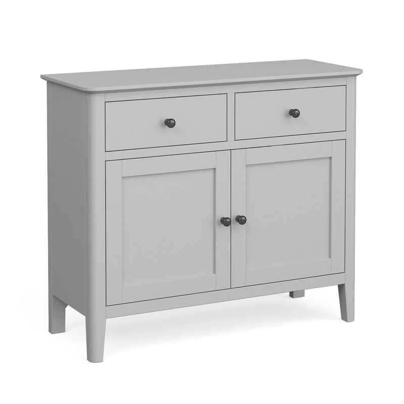 The Stowe Small Sideboard is a light gray wooden cabinet with two top drawers and two lower doors, each with round black knobs. Its smooth surface and modern design make it perfect for storing items like a 95cm dog bed or large pet bed.