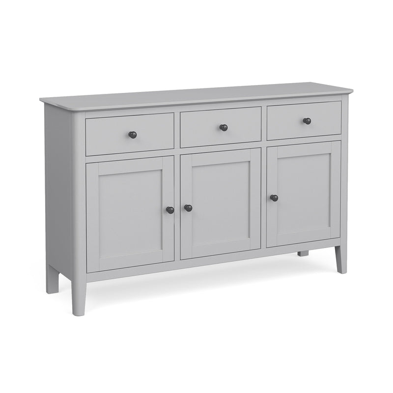 A gray sideboard with three drawers and three doors, featuring round metal handles and a soft grey finish.