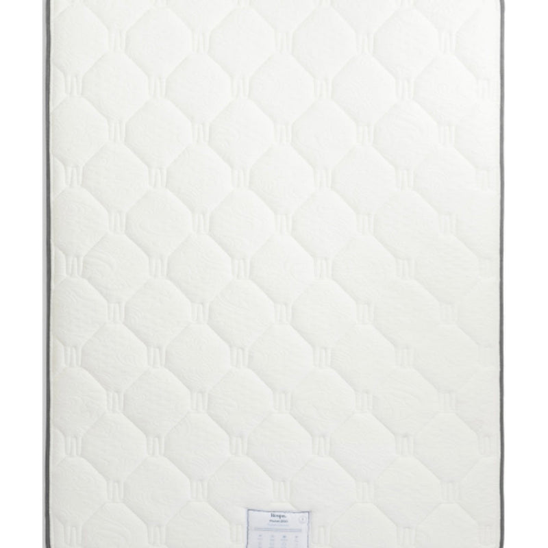 The Respa Ashford Mattress is white with a quilted, textured surface featuring a repeating hexagonal pattern and a small label at the bottom edge, and it’s enhanced with Sleepfresh technology for improved comfort.