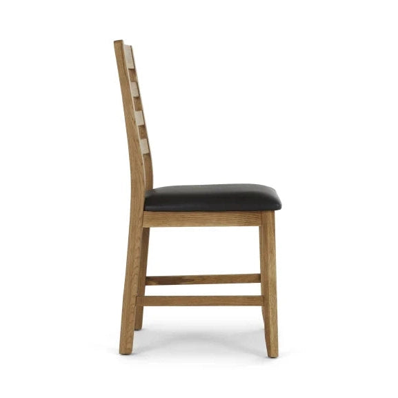 Side view of the Edson Dining Chair, made of oak with a curved slatted backrest and black PU seat cushion, shown against a plain white background.