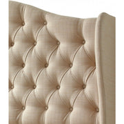 Close-up of the Respa Miranda headboard, featuring a beige upholstered, diamond-tufted design with fabric-covered buttons, soft textured fabric, and gently curved Queen Anne-style edges.