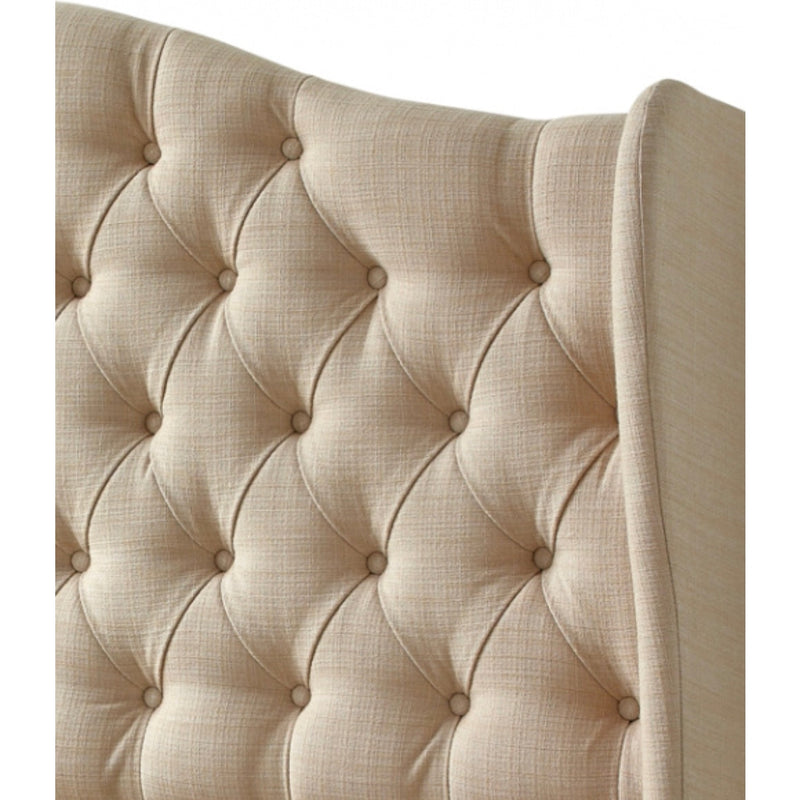 Close-up of the Respa Miranda headboard, featuring a beige upholstered, diamond-tufted design with fabric-covered buttons, soft textured fabric, and gently curved Queen Anne-style edges.