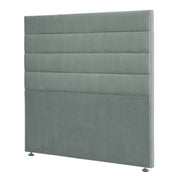 Modern upholstered headboard with horizontal channels and metal legs.