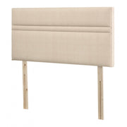 The Respa Topaz headboard is a beige upholstered rectangular headboard with two wooden support legs, a modern design, and a horizontal seam near the top. Compatible with most bed frames and available in various colours.