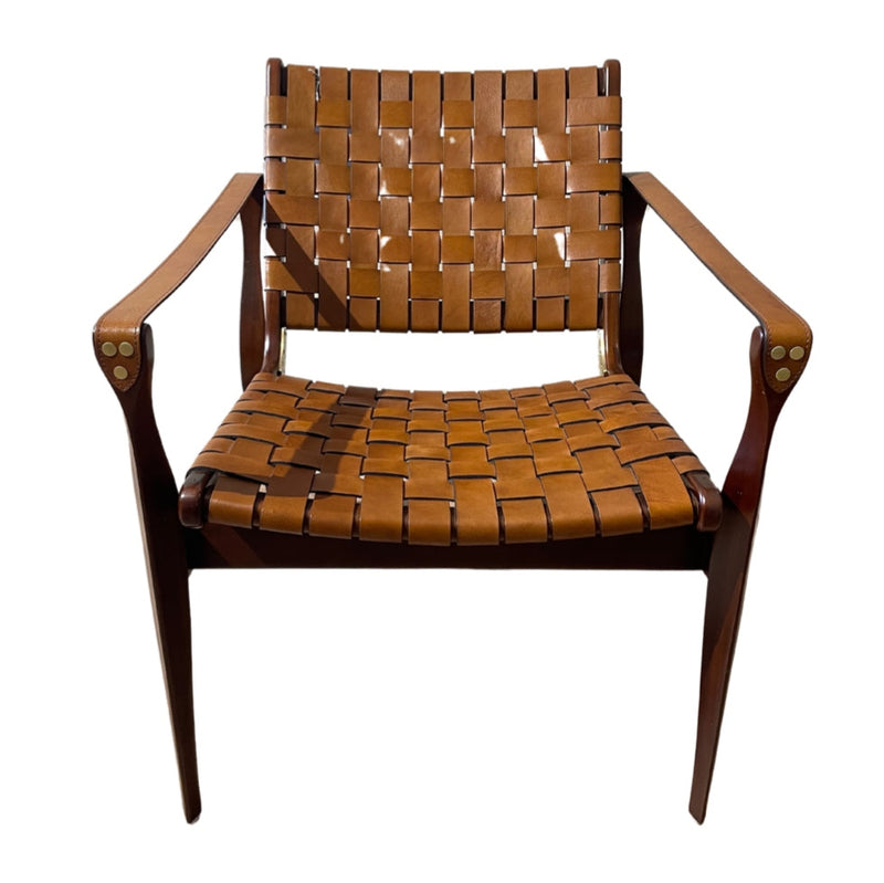 The Pres 55 is a mahogany chair with a wooden frame, woven tan leather seat and backrest, and angled armrests and legs, featuring a weaved design, shown against a white background.