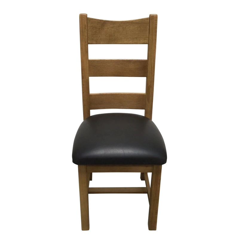 A wooden dining chair with a black leather seat and backrest.