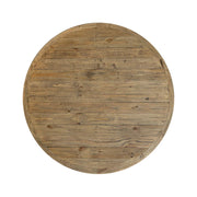 The New Jersey Dining Table is a round design with a natural wood finish, visible grain and knots, horizontal plank tabletop, and a slightly raised edge—bringing rustic charm to any inviting dining space.