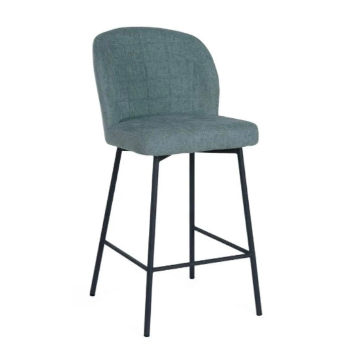 The Clio bar stool features a cushioned seat and backrest in light gray fabric, slim black metal legs, and a convenient footrest, offering a modern touch to any kitchen.