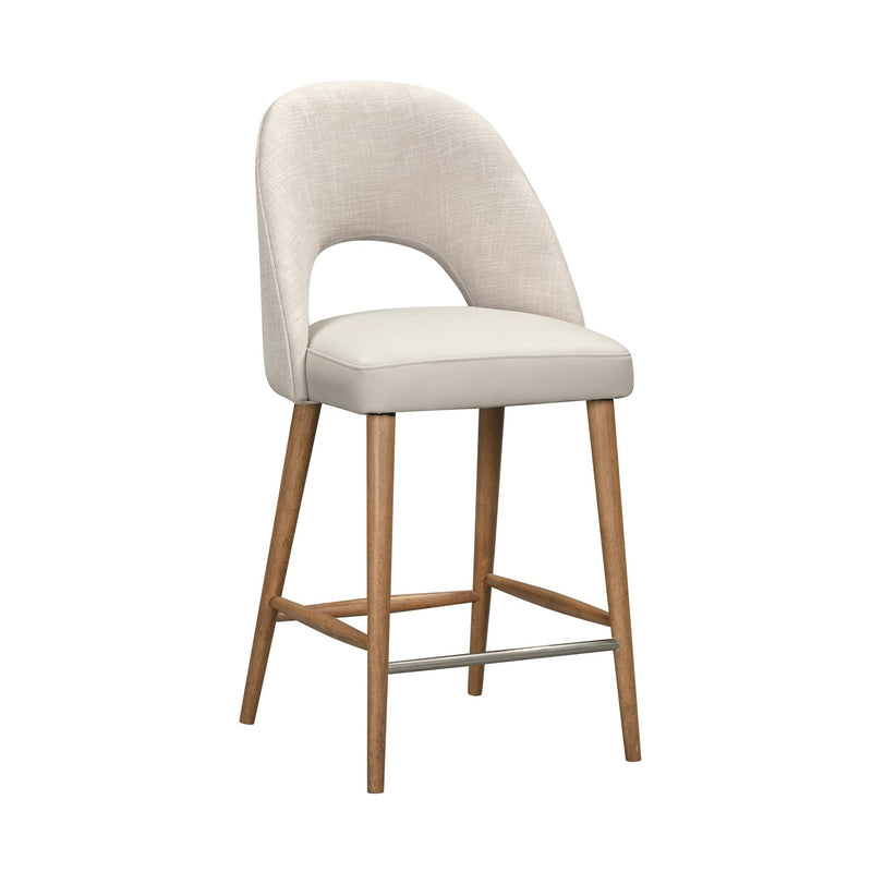 The Florence Counter Stool features a light beige upholstered seat and backrest, an open lower back, wooden legs, and a metal footrest, shown against a white background.