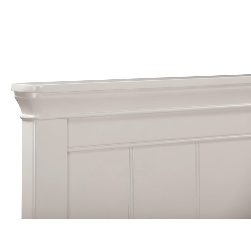 A close-up of the white wooden headboard on the Lima Bedframe highlights its simple, classic design and top-edge decorative molding.