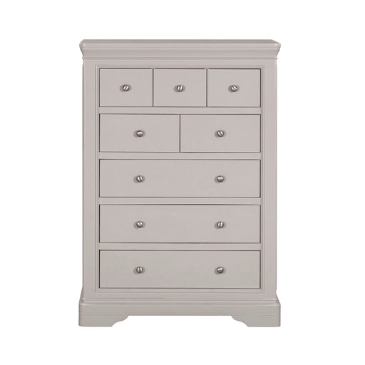 The Lima Tall Chest, in light gray with a modern design, features seven drawers of varying sizes, each with a round silver knob—an ideal addition to any taupe bedroom collection.