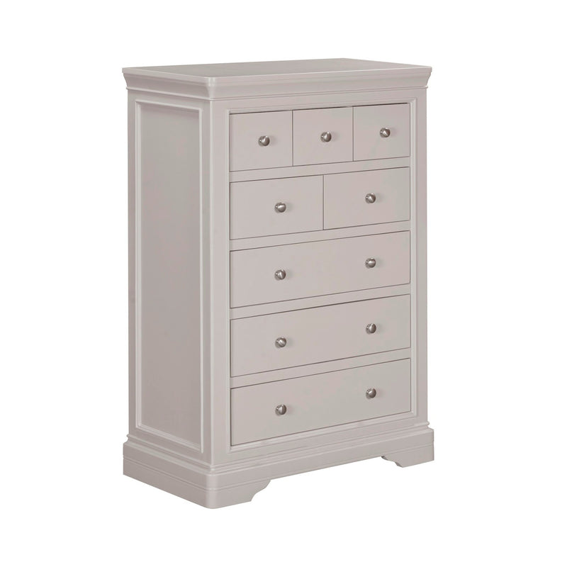 The Lima Tall Chest, in light gray wood, features six spacious drawers and four smaller upper drawers with round metal knobs, adding stylish storage to your bedroom furniture collection.