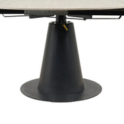 A close-up of the Como Swivel Dining Table's round, black, cone-shaped pedestal base with visible metal mechanisms beneath its modern tabletop.