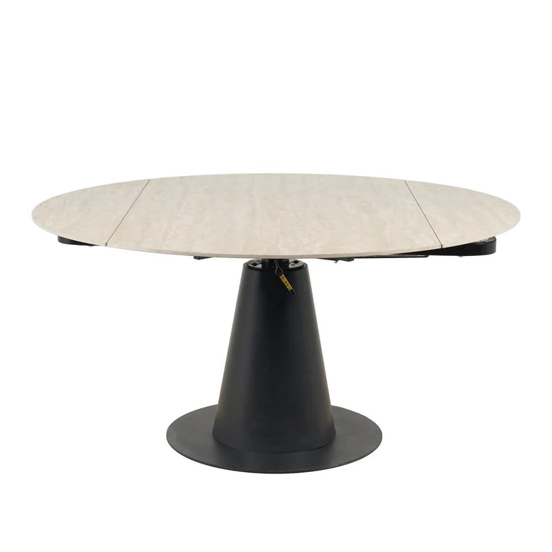 The Como Swivel Dining Table features a round light wood tabletop and a black, cone-shaped pedestal base, shown against a plain white background.