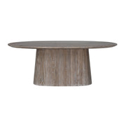 The Dakota Dining Table showcases a round, washed raw wood top with a natural wood grain finish, supported by a wide cylindrical pedestal base for a modern look.