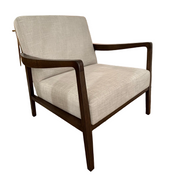 The Monza Armchair features light beige linen upholstery and a dark walnut frame with straight arms and legs, shown isolated on a white background.