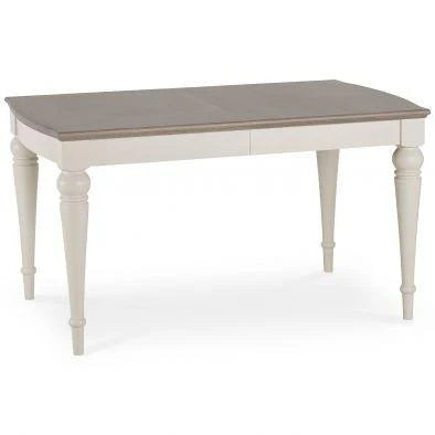 The Montreux Dining Table features a rectangular wooden top in light brown with white turned legs. Its simple, classic design makes it perfect for pairing with upholstered chairs in your dining room or kitchen.