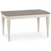 The Montreux Dining Table features a rectangular wooden top in light brown with white turned legs. Its simple, classic design makes it perfect for pairing with upholstered chairs in your dining room or kitchen.