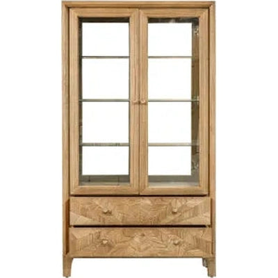The Solstice Display Cabinet features a chevron pattern, glass doors, three interior shelves, and two carved drawers at the bottom, shown against a white background.