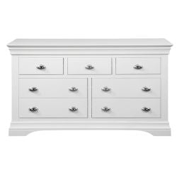 The Bella Wide Drawer Chest is a white wooden dresser from the Bella range with seven drawers, finished in semi-gloss white and featuring elegant chrome cup handles for a classic, simple look.