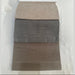 A fabric swatch card labeled REMIND BASE AND HEADBOARD shows three rectangular samples—ideal for selecting upholstery for the Hilton Storage Bedframe—pinned to a white card on a textured white background.