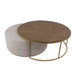 The Todi Round Coffee Table & Stool Set features a round wooden tabletop on a gold metal frame with a matching light beige upholstered ottoman, both with gold bases, ideal for modern interiors and styled against a white background.