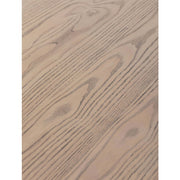 Close-up of the Falun Round Dining Table's light wood surface, showcasing prominent natural grain patterns and knots. The smooth, matte finish emphasizes its elegant craftsmanship.