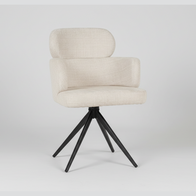 The Orbit Dining Chair features natural beige fabric upholstery, a curved backrest with armrests, and four black metal legs that splay outward for support. Shown against a plain white background.