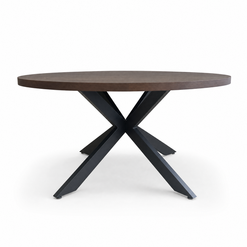 The Olson 1.5 Round Dining Table features a dark brown top and black metal crossed legs, seating six guests. Its striking design stands out beautifully against a white background.
