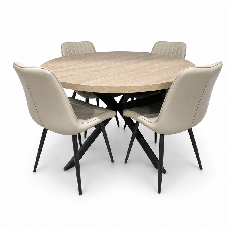 The Dalton Table + 4 Lyra Chairs set features a round dining table with four beige, padded chairs with black metal legs, all arranged on a white background for a subtle industrial look.