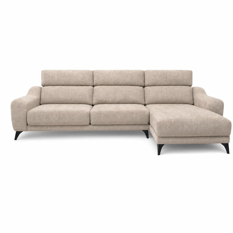 The Nomi Sliding Seat Chaise is a modern beige sofa with three seat cushions, plush backrests, a right-facing chaise lounge, and black legs, showcased against a white background.