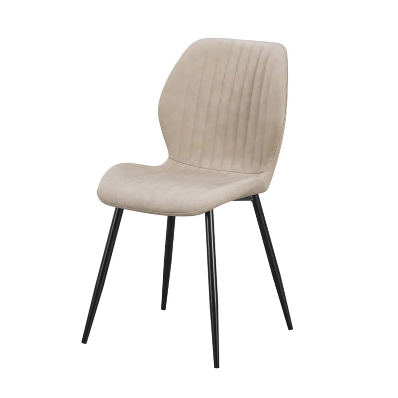 The Lyra Dining Chair in beige faux leather showcases a curved backrest, vertical stitching, and four slender black metal legs, displayed against a white background.