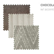 Three chenille fabric swatches—one in dark brown, one in solid cream, and one in cream with a gray chevron pattern—are displayed with zigzag-cut edges, offering sophisticated options for your Henley Sofa or modular configuration. The chenille fabric enhances both comfort and modern appeal.
