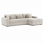 The Henley Sofa is a beige contemporary sectional featuring a right-side chaise lounge, three seat cushions, and four decorative pillows in matching patterns. It is upholstered in soft chenille fabric and displayed against a white background.