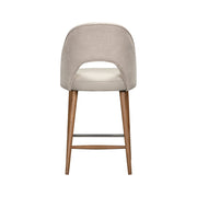 The Florence Counter Stool features a light beige upholstered backrest, white cushioned seat, wooden legs, and metal footrest, shown from the back against a white background.
